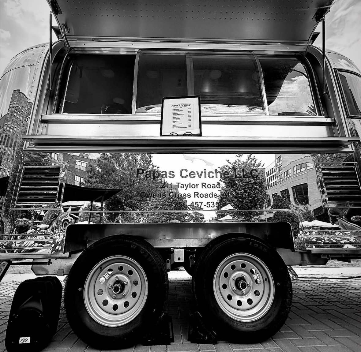 The Papas Ceviche Airstream food truck set up at a market